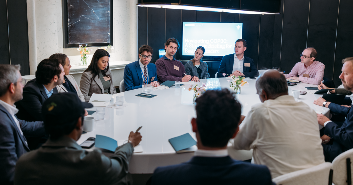 Participants gather around a table. 