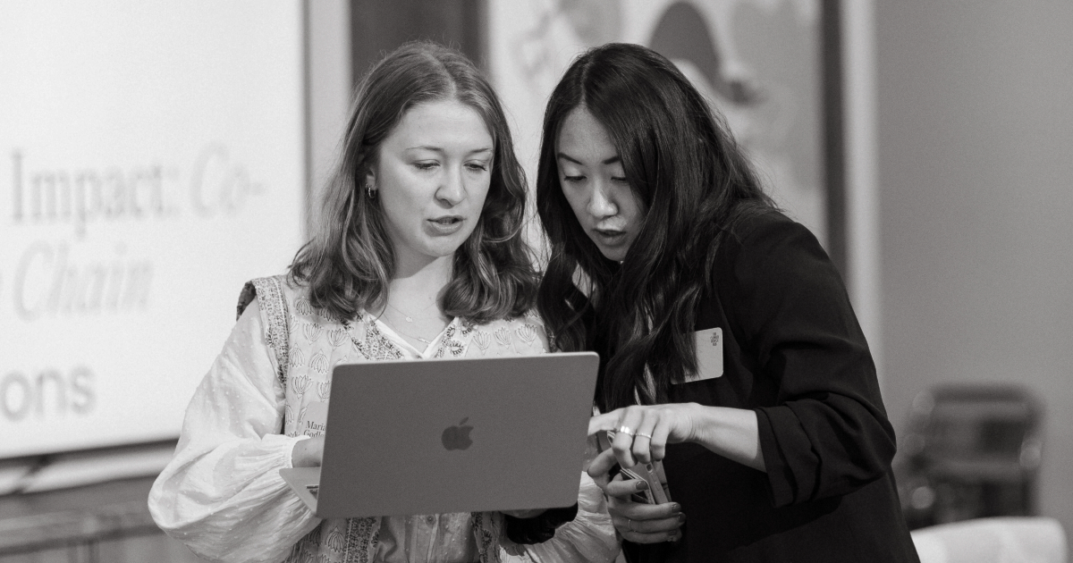 Maria Godlewska, Program Manager, Global Optimism, and Alexis Ip, Events Lead, The Climate Pledge, prep for the “Inspiration to impact” session. 